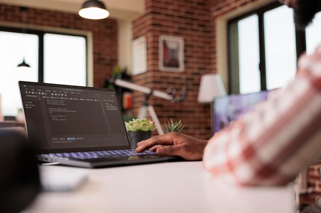 african american engineer programming app code, developing online software with cloud server and firewall security. coding new user interface with binary code html program, web development.