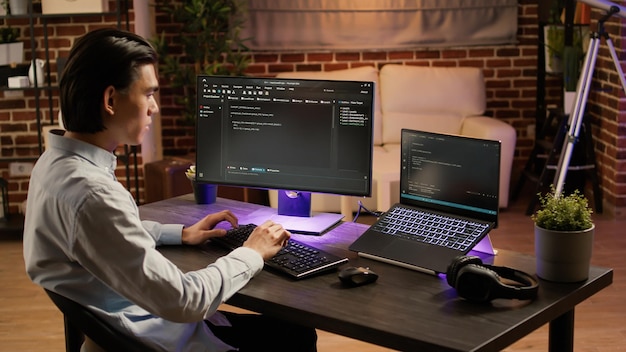 male system hacker coding security program on pc software, programming firewall data on encryption server. using computer to code application script on display. .