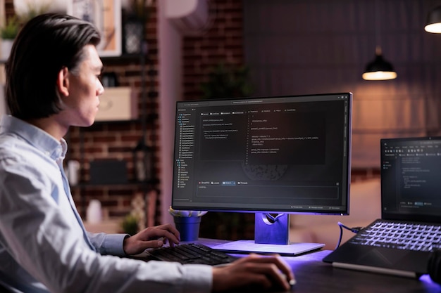 asian coder programming server encryption on firewall software, using security network interface to code system data for app development. working with binary code text to script program.