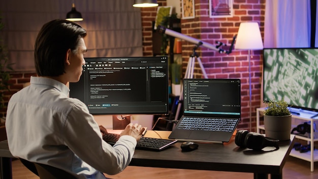 asian developer programming code on firewall server, using computer and binary code to program application system. coding security network with hacking encryption. .
