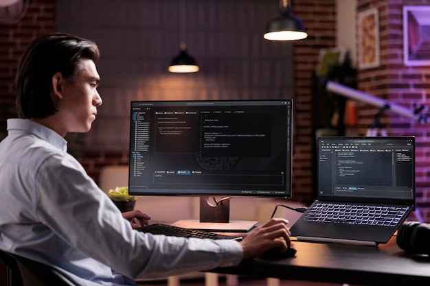 asian developer using binary code to script security system, programming firewall encryption. working with program data server to develop network on coding software, using advanced app interface.