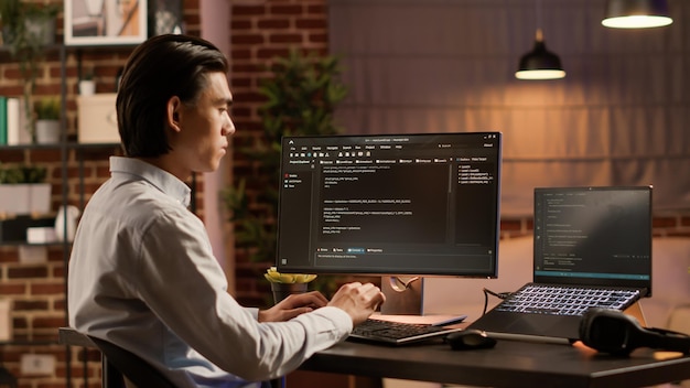 asian programmer using binary code to script security system, programming firewall encryption. working with data server to develop network on coding software, hacking application.