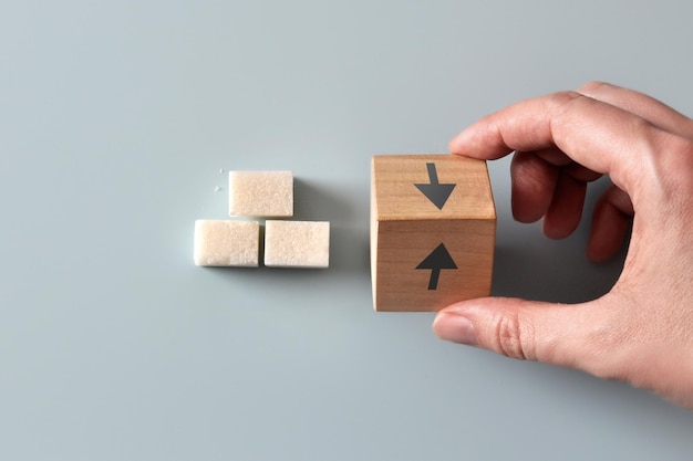blood sugar increase and decrease concept with cubes and arrows