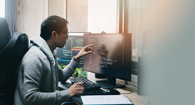 coder programmers working in office programmer analyst writing code coder working from home with work on screen computer for learning and developing programs digital coding scripts java language