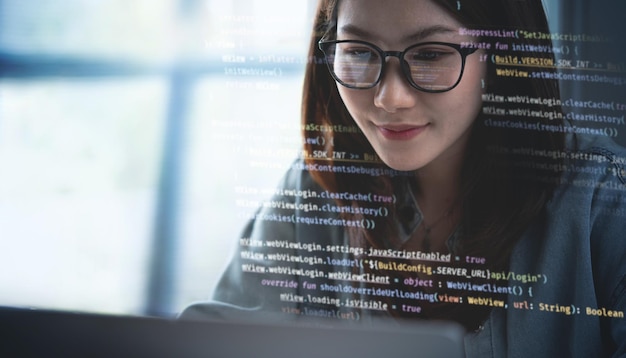 computer programmer software engineer typing coding javascript on laptop computer software development concept website design and coding technology