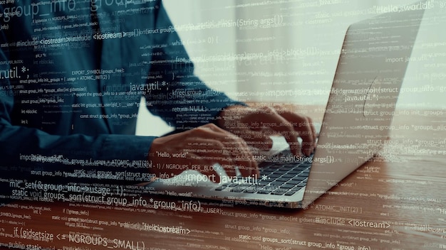 computer programmer uses capable laptop computer to develop programming code