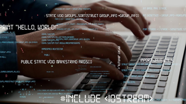 computer programmer uses capable laptop computer to develop programming code