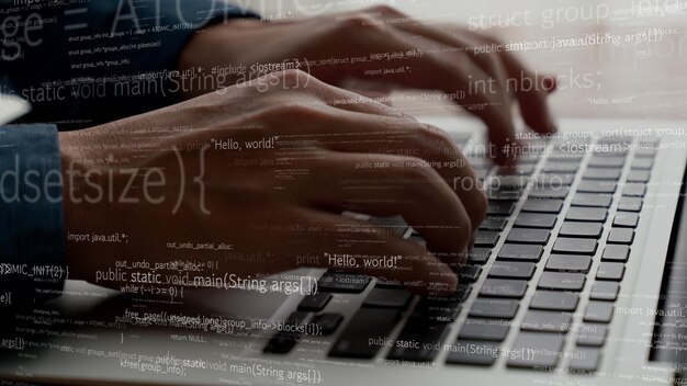 computer programmer uses capable laptop computer to develop programming code