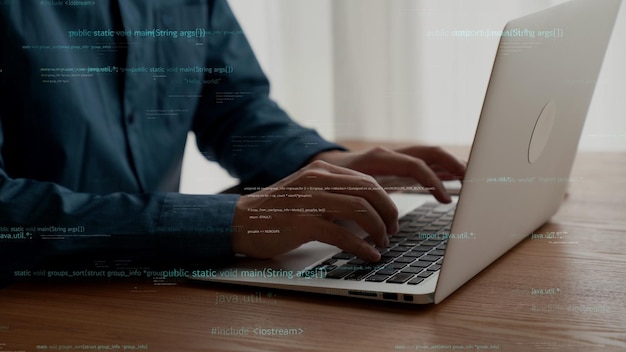 computer programmer uses capable laptop computer to develop programming code