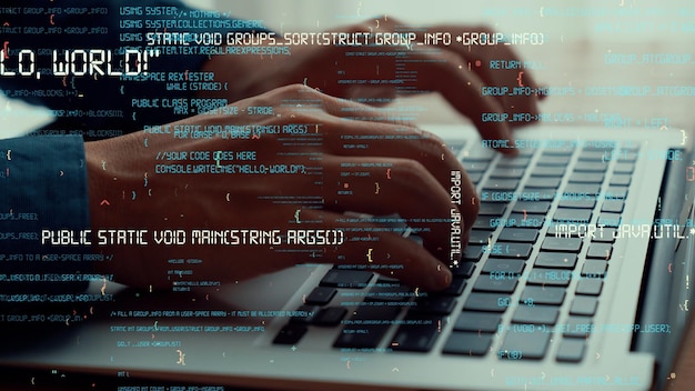 computer programmer uses capable laptop computer to develop programming code