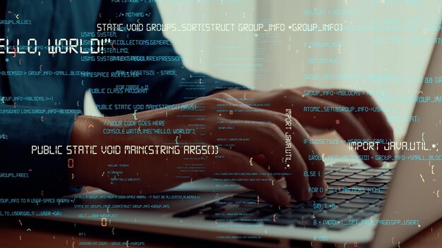 computer programmer uses capable laptop computer to develop programming code