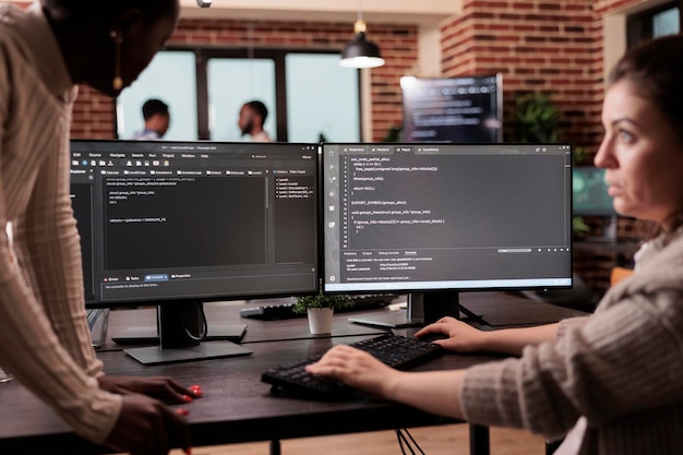 diverse programming engineers developing html code and cloud computing in it development agency. software developer working on database programming with html script, computing big data.