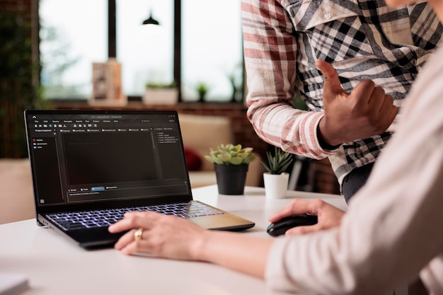 diverse web developers programming html script at home, using encryption and program code to develop new user interface. learning online app security firewall on terminal window, coding server.