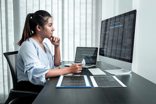 female developer programmer working on coding program software computer