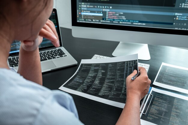 female developer programmer working on coding program software computer