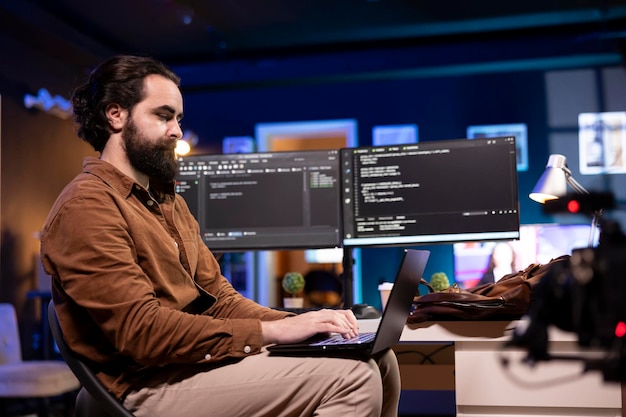programmer doing software debugging using laptop checking errors in code