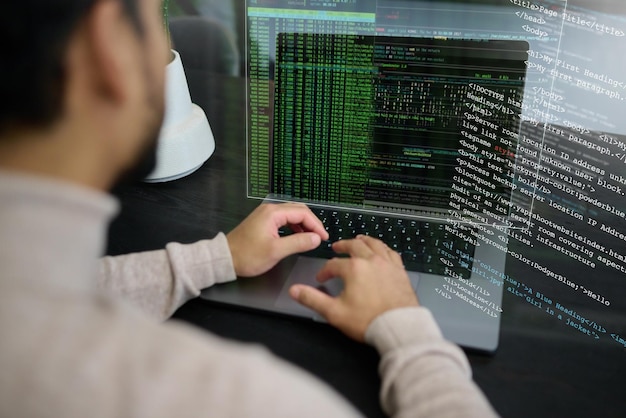 programmer man and laptop coding on hologram software development or cloud computing it engineer server overlay and computer code of website digital algorithm or big data of networking developer