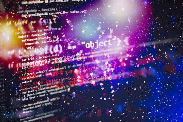 programmer working in a software develop company office. digital binary data on computer screen. computer script typing work. programming code abstract screen of software developer.