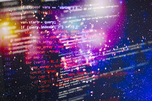 programmer working in a software develop company office. digital binary data on computer screen. computer script typing work. programming code abstract screen of software developer.