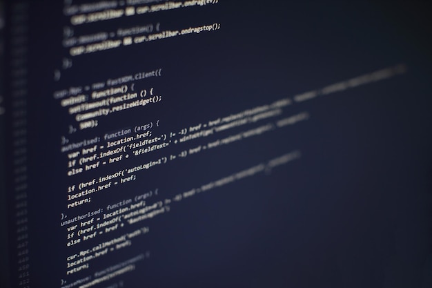 programming code on computer screen. software development. writing program code on computer.