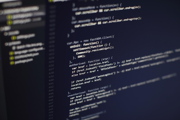 programming code on computer screen. software development. writing program code on computer.