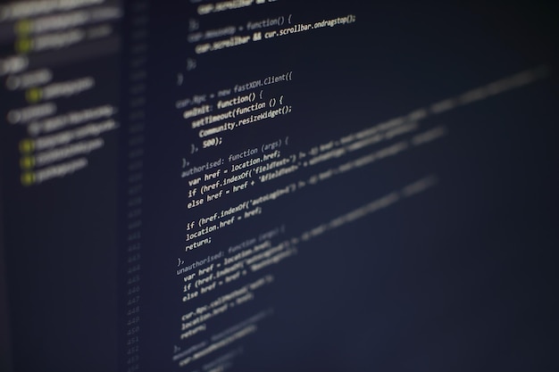 programming code on computer screen. software development. writing program code on computer.