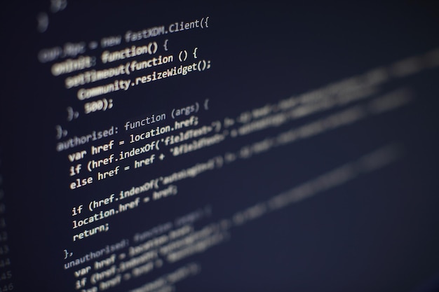 programming code on computer screen. software development. writing program code on computer.