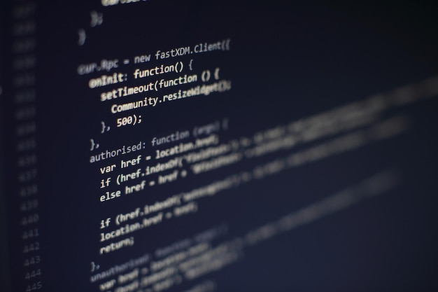 programming code on computer screen. software development. writing program code on computer.