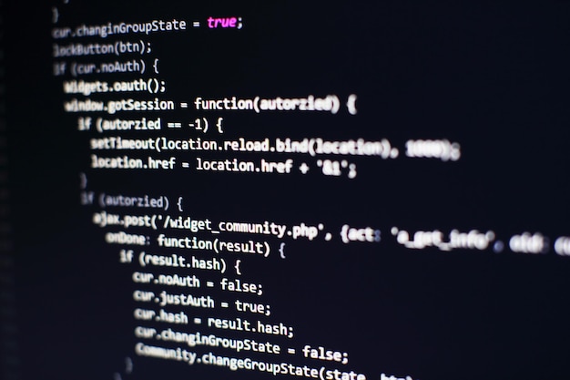 programming code on computer screen. software development. writing program code on computer.