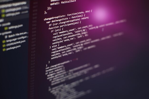 programming code on computer screen. software development. writing program code on computer.