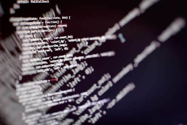 programming code on computer screen. software development. writing program code on computer.