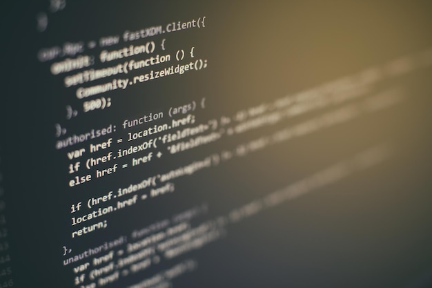 programming code on computer screen. software development. writing program code on computer.