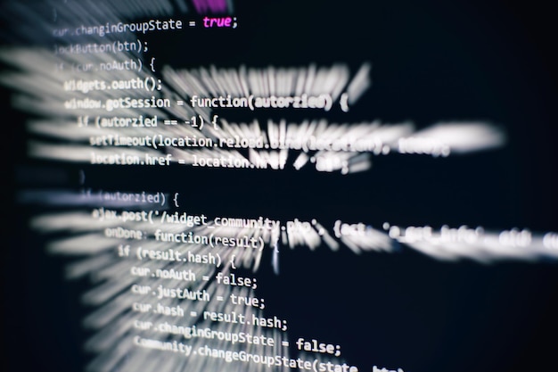 programming code on computer screen. software development. writing program code on computer.