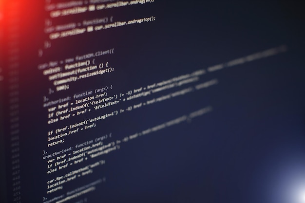 programming code on computer screen. software development. writing program code on computer.