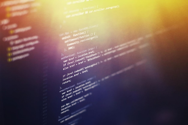 programming code on computer screen. software development. writing program code on computer.