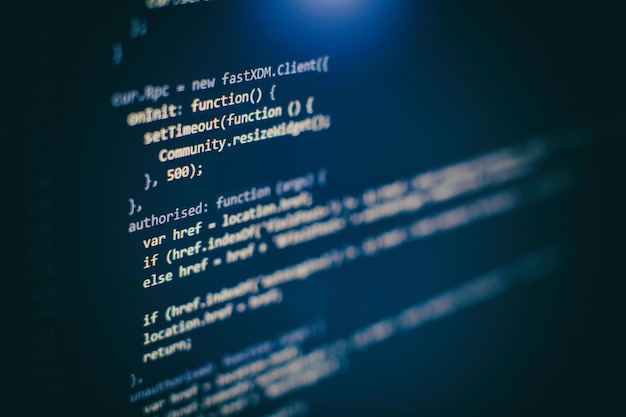 programming code on computer screen. software development. writing program code on computer.