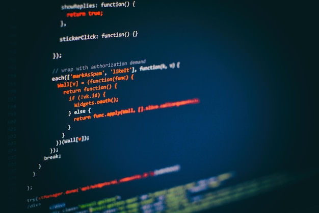 programming code on computer screen. software development. writing program code on computer.