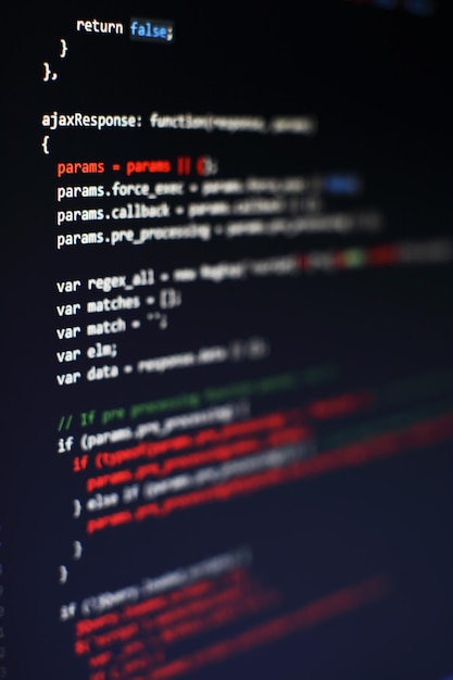 programming code on computer screen. software development. writing program code on computer.