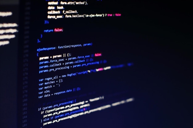 programming code on computer screen. software development. writing program code on computer.