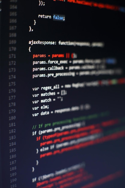 programming code on computer screen. software development. writing program code on computer.