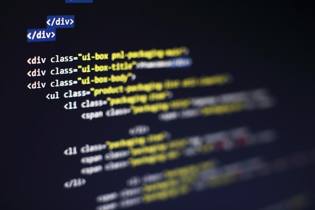 programming code on computer screen. software development. writing program code on computer.