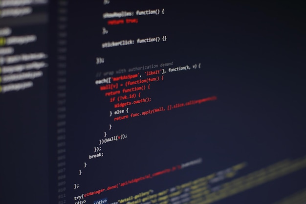 programming code on computer screen. software development. writing program code on computer.