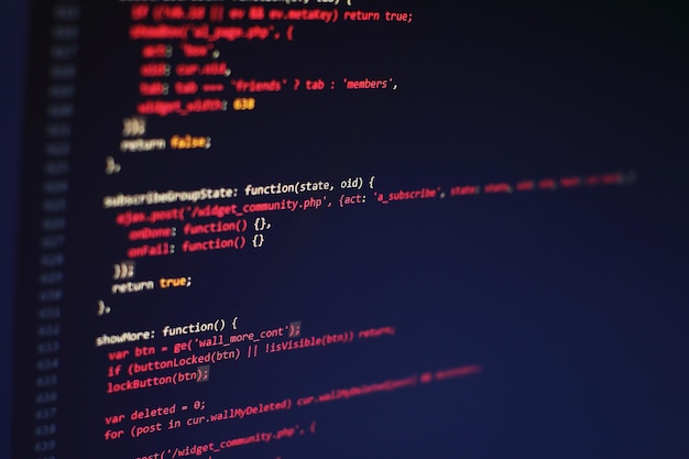 programming code on computer screen. software development. writing program code on computer.