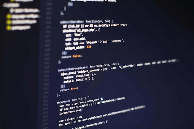 programming code on computer screen. software development. writing program code on computer.