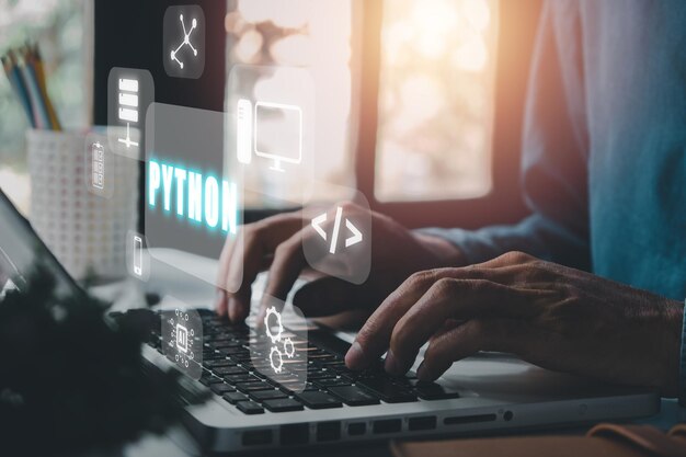 python programming languageman using laptop computer with python programming icon on virtual screen application and web development concept