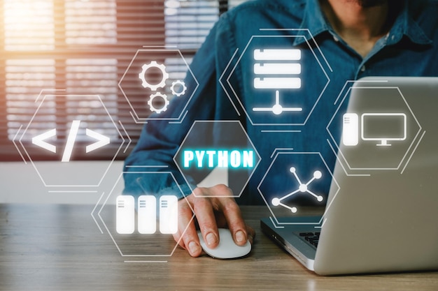 python programming languageman using laptop computer with python programming icon on virtual screen application and web development concept