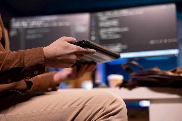 software developer opening laptop to write programs in java programming language
