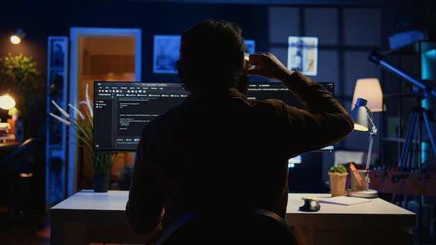 software engineer writes complex binary code scripts on computer
