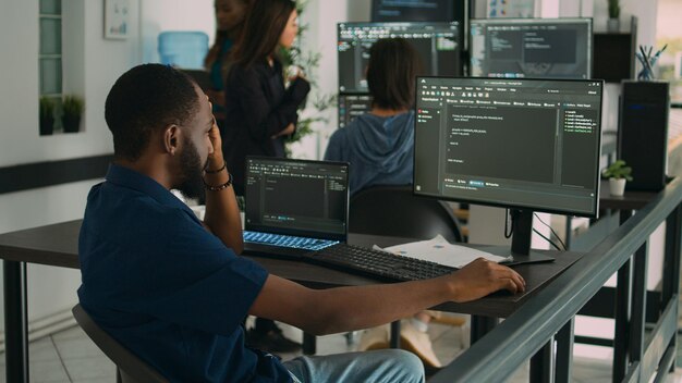 software programer brainstorming ideas to write code and create security program, displaying artificial intelligence algorithm. pensive app developer thinking about database cloud computing.