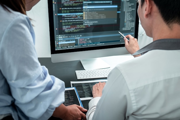 team of developer programmer working on coding program software computer in office